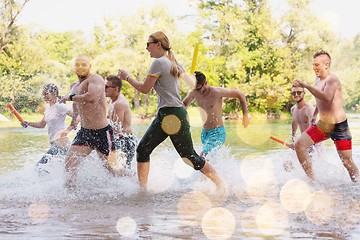 Image showing summer joy friends having fun on river