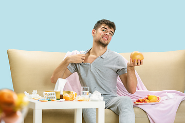 Image showing Young man suffering from allergy to citrus fruits