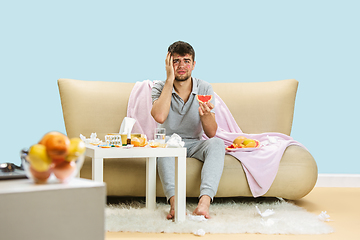 Image showing Young man suffering from allergy to citrus fruits