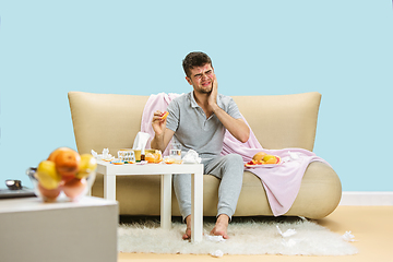 Image showing Young man suffering from allergy to citrus fruits