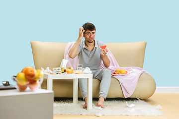 Image showing Young man suffering from allergy to citrus fruits