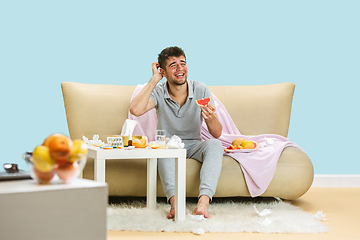 Image showing Young man suffering from allergy to citrus fruits