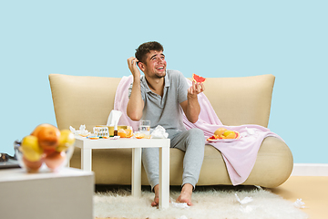 Image showing Young man suffering from allergy to citrus fruits