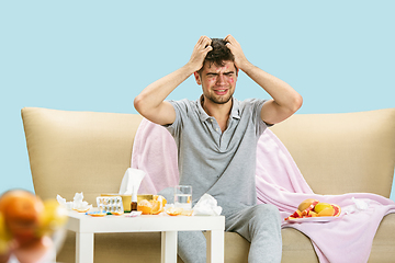 Image showing Young man suffering from allergy to citrus fruits