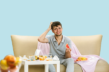 Image showing Young man suffering from allergy to citrus fruits