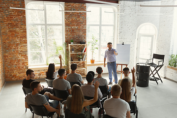 Image showing Male speaker giving presentation in hall at university workshop