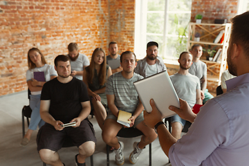 Image showing Male speaker giving presentation in hall at university workshop