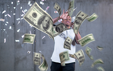 Image showing black businessman making the rain of money