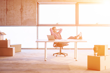 Image showing young casual businessman taking a break on construction site