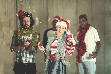 Image showing multiethnic group of casual business people having confetti part