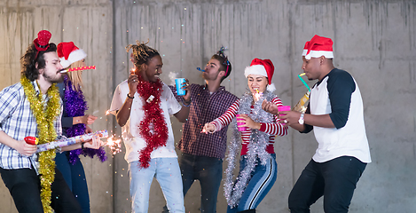 Image showing multiethnic group of casual business people having confetti part