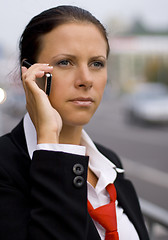 Image showing businesswoman talking by mobile phone