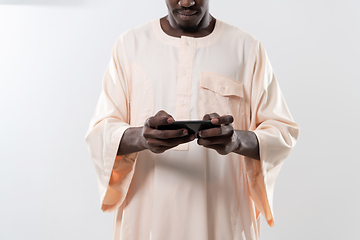 Image showing african man using smartphone