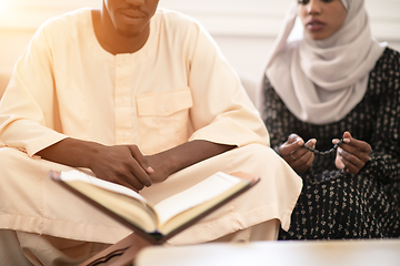 Image showing african couple at home reading quaran