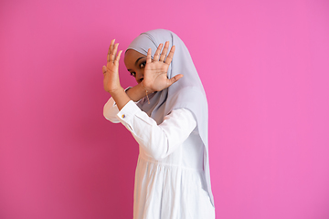 Image showing african muslim woman showing two hands stop gesture against vilo