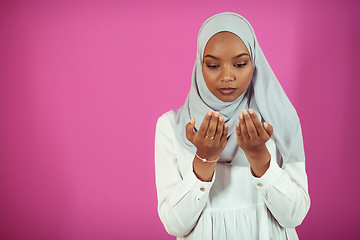 Image showing African Muslim woman makes traditional prayer to God