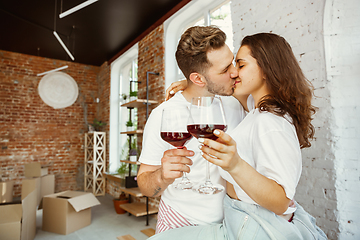 Image showing Young couple moved to a new house or apartment