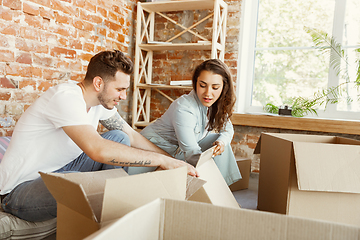 Image showing Young couple moved to a new house or apartment