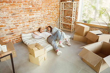 Image showing Young couple moved to a new house or apartment