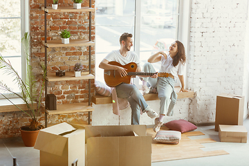 Image showing Young couple moved to a new house or apartment