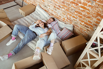 Image showing Young couple moved to a new house or apartment