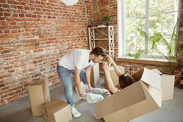 Image showing Young couple moved to a new house or apartment