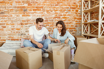 Image showing Young couple moved to a new house or apartment