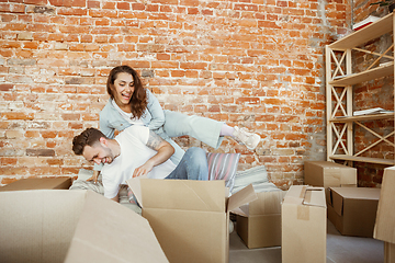 Image showing Young couple moved to a new house or apartment