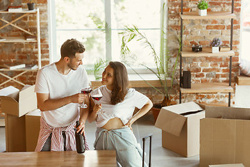 Image showing Young couple moved to a new house or apartment