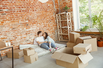 Image showing Young couple moved to a new house or apartment