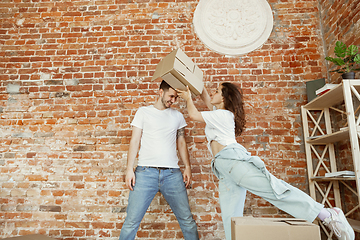 Image showing Young couple moved to a new house or apartment