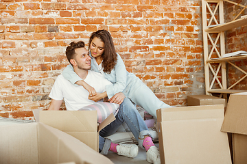 Image showing Young couple moved to a new house or apartment