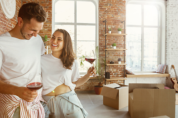 Image showing Young couple moved to a new house or apartment