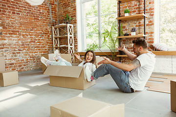 Image showing Young couple moved to a new house or apartment