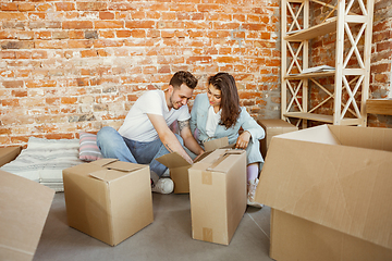 Image showing Young couple moved to a new house or apartment