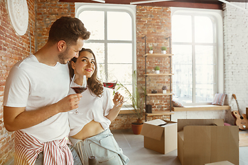 Image showing Young couple moved to a new house or apartment