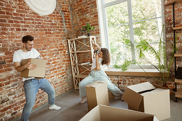 Image showing Young couple moved to a new house or apartment