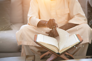 Image showing african couple at home reading quaran