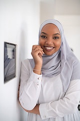 Image showing african woman using smart home screen