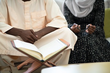 Image showing african couple at home reading quaran