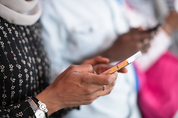 Image showing african students group using smart phones