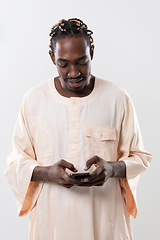 Image showing african man using smartphone