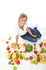 Image showing Fruits and blond cute woman