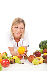 Image showing Fruits and blond cute woman