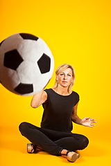 Image showing woman playing with a soccer ball