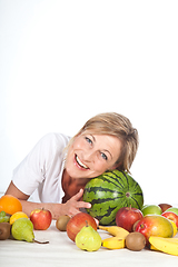 Image showing Fruits and blond cute woman