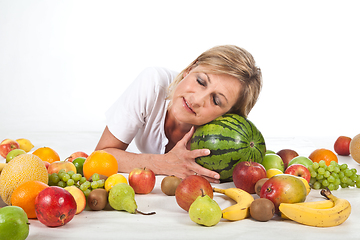 Image showing Fruits and blond cute woman