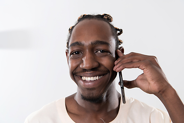 Image showing african man using smartphone