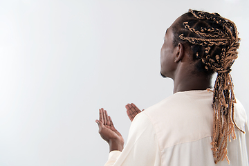 Image showing african man pray to Allah