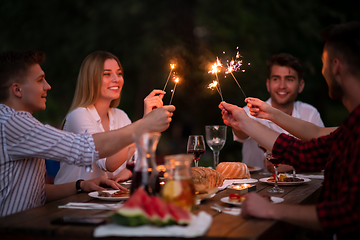 Image showing happy friends having french dinner party outdoor